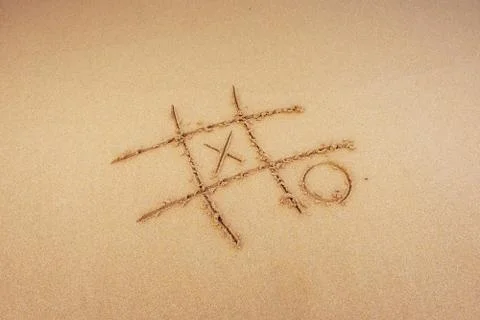Figures in the sand on the beach Stock Photos