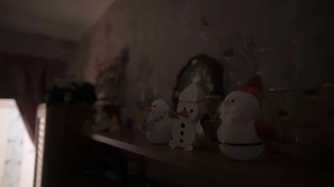 Figures of snowmen stand on a shelf Stock Footage 81388484