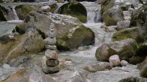 Figures of stones in the middle of a stormy stream Stock Footage 115421499