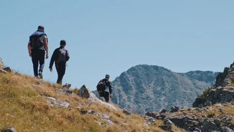 Figures of tourists walking make transition in mountains range Stock Footage 142140738