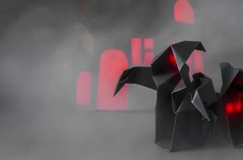 Figures of two dark ghosts with a red glow in the fog against the background . Stock Photos