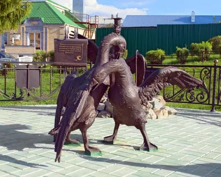 The figures of two fighting geese Stock Photos