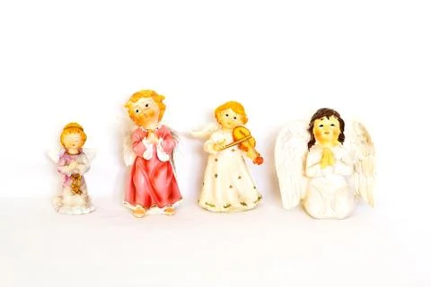 Figurines of angel on white background Stock Photos