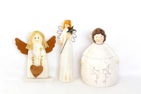 Figurines of angel on white background Stock Photos