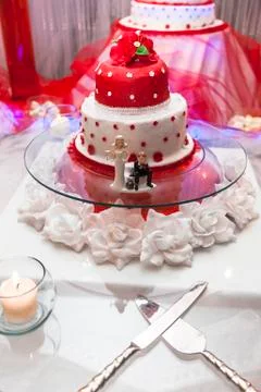 Figurines on bottom of wedding cake Stock Photos