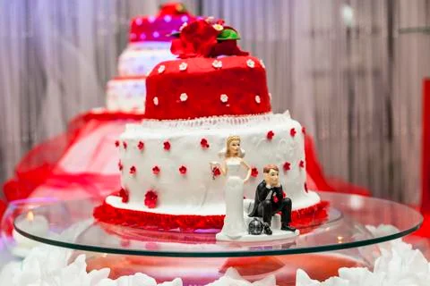 Figurines on bottom of wedding cake Stock Photos