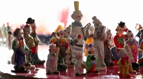 Figurines of Clowns on Floating Platform Stock Footage 58644598