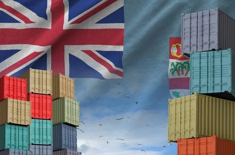 Fiji flag and big stack of shipping cargo containers in docks with sky Stock Illustration