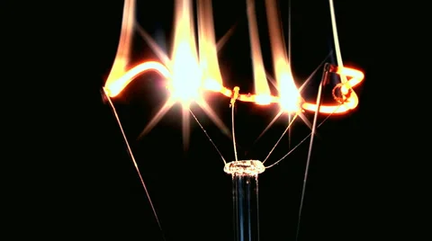Filament light bulb is dissolved in the plasma swirling, sparkling beauty. Stock Footage 43338534