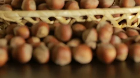 Filbert nuts. Placer in a wicker basket, close-up Stock Footage 71475083