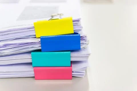 File folder and Stack of business report paper file on the table Photos