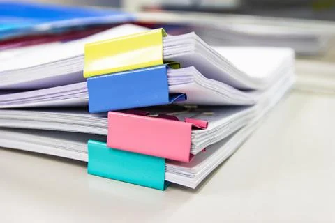 File folder and Stack of business report paper file on the table Photos