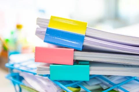 File folder and Stack of business report paper file on the table Photos