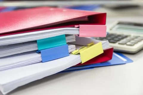 File folder and Stack of business report paper file on the table Photos