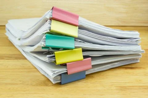 File folder and Stack of business report paper file on the table Photos