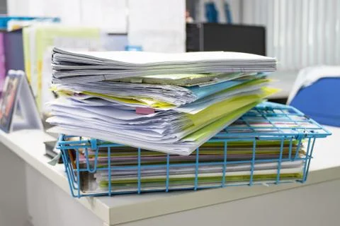 File folder and Stack of business report paper file on the table Photos