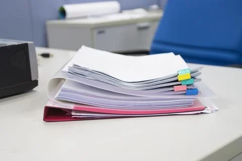 File folder and Stack of business report paper file on the table Stock Photos