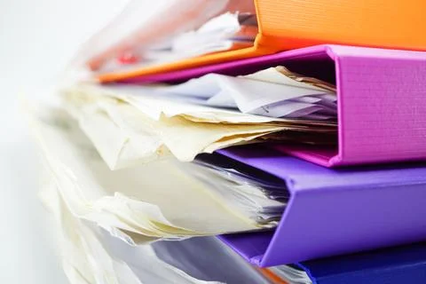 File Folder Binder stack of multi color on table in office. Stock Photos