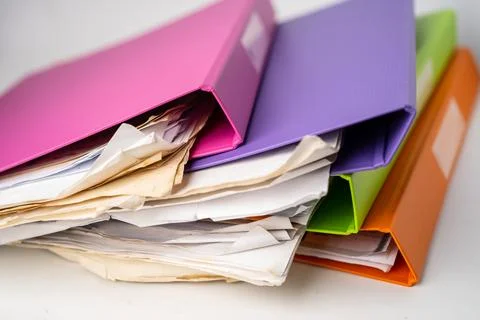 File Folder Binder stack of multi color on table in office. Stock Photos
