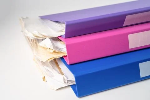 File Folder Binder stack of multi color on table in office. Stock Photos