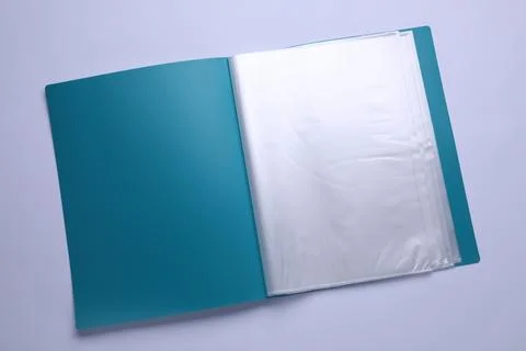 File folder with punched pockets and paper sheets isolated on white, top view Stock Photos