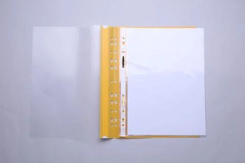 File folder with punched pockets and paper sheets on light grey background,.. Stock Photos