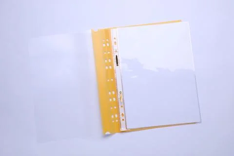 File folder with punched pockets and paper sheets isolated on white, top view Stock Photos