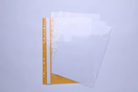 File folder with punched pockets and paper sheets isolated on white, top view Stock Photos