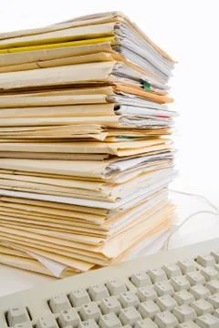 File Stack and Computer Keyboard Stock-Fotos