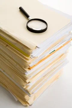 File Stack and Magnifying Glass Stock Photos
