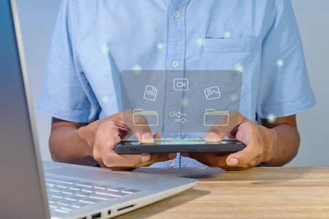 File transfer between mobile phone and laptop Stock Photos