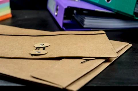 Files of paperwork on desk Stock Photos
