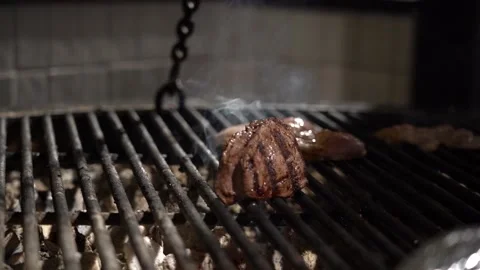 Filet mignon. A delicious beef steak is frying on the grill grid on the Stock Footage 236598723