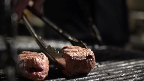 Filet mignon is fried on the grill close-up Видео 156241689