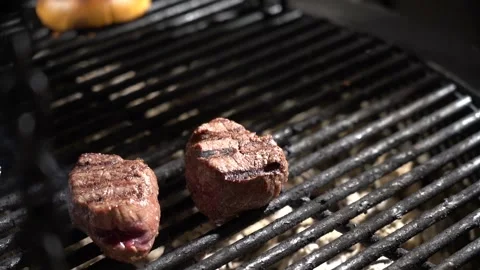 Filet mignon is fried on the grill close-up Stock Footage 169641568