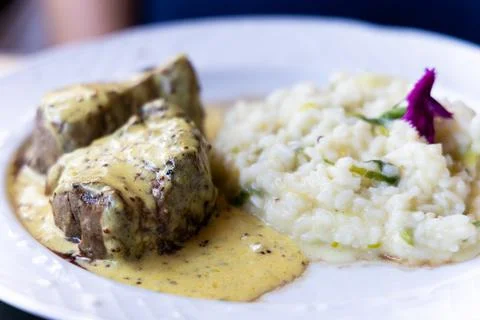 Filet mignon with risotto Stock Photos