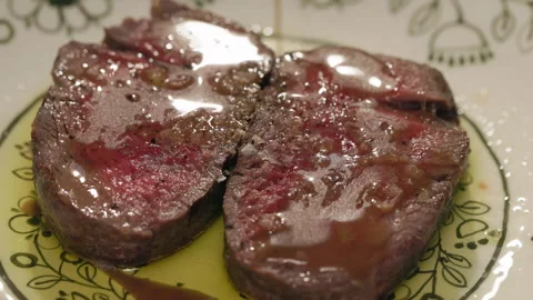 Filet mignon steak getting poured with sauce from spoon Vidéo 276374220