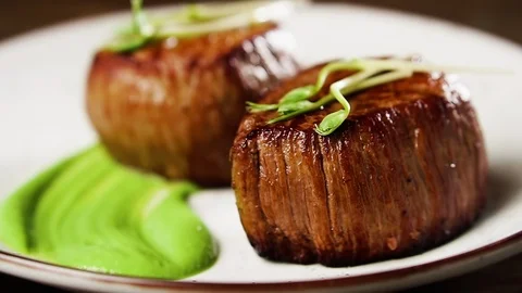 Filet mignon steak with mashed green peas and green pea sprouts. 動画素材 126221768