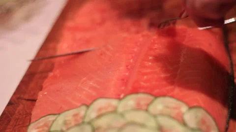 Fileting salmon at an event Stock Footage 37585826