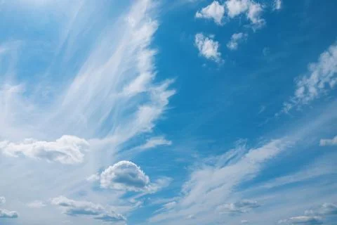 Filiform clouds over blue sky. Natural background. Stock Photos