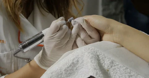 Filing and grinding nails.Nail polish remover.Manicure arranging nails,close up. Stock Footage 59717745