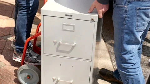 Filing cabinet loaded onto a dolly 库存影片 276318824