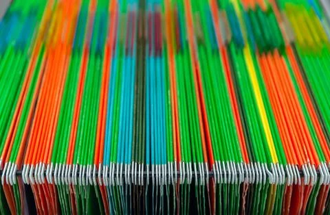 Filing cabinets filled with files of several colors. Abstract background Stock Photos