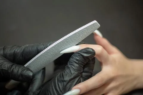 Filing Long Stiletto Nails Stock Photos