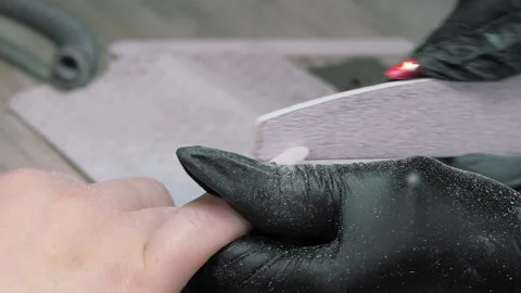 Filing the nail of the hand with a nail file. Hardware combined manicure. Manicu Video stock 211478271