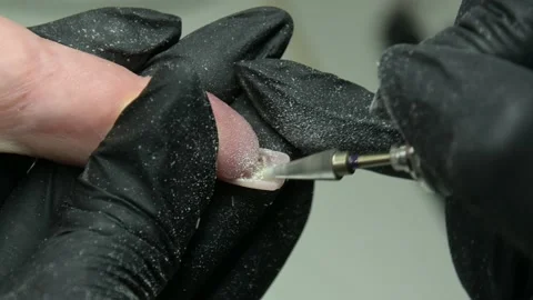 Filing the nail from the inside with a special tool. creating the perfect nail Stock Footage 205524706