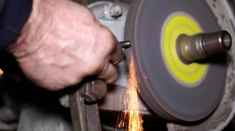 Filing a Piece of Iron with a Rotating Filing Machine Stock Footage 45431667