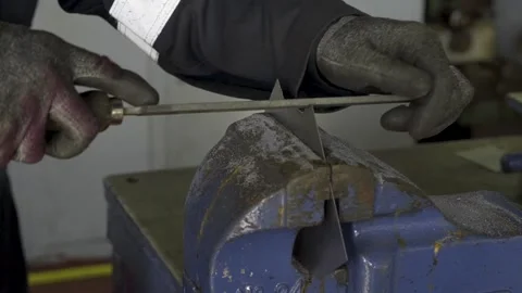 Filing a Piece of Metal Stock Footage 151427216