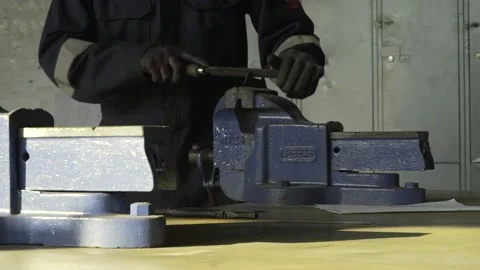 Filing a Piece of Metal Stock Footage 151556415