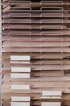 Filing shelf with light brown documents 스톡 사진